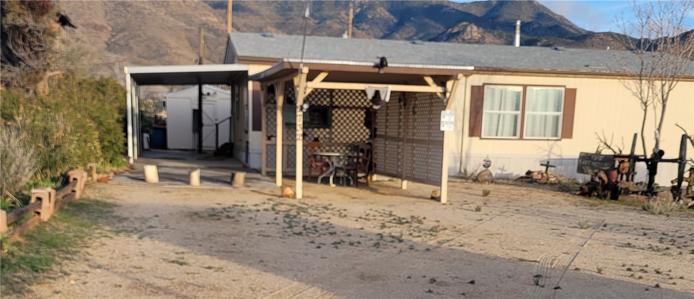 9732 2nd Street Chloride, AZ 86431 - Photo 2 of 28 The property features a carport and a covered patio area