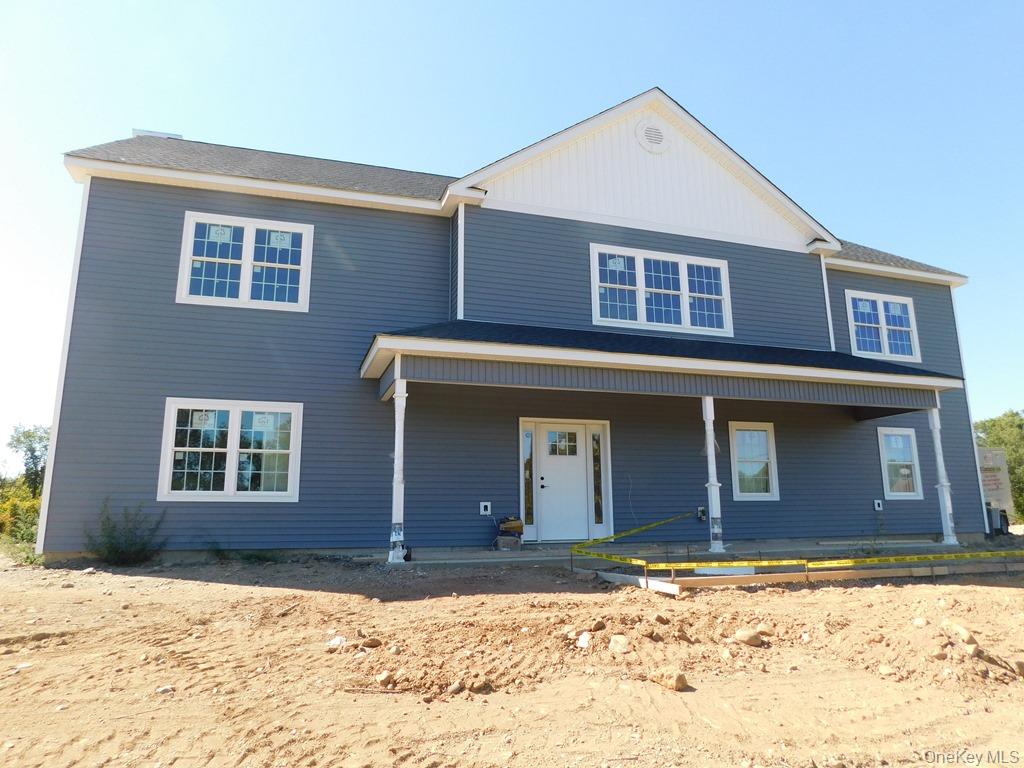 84 Quaker Street Wallkill, NY 12589 - Photo 1 of 1 View of front of property featuring a porch and board and batten siding