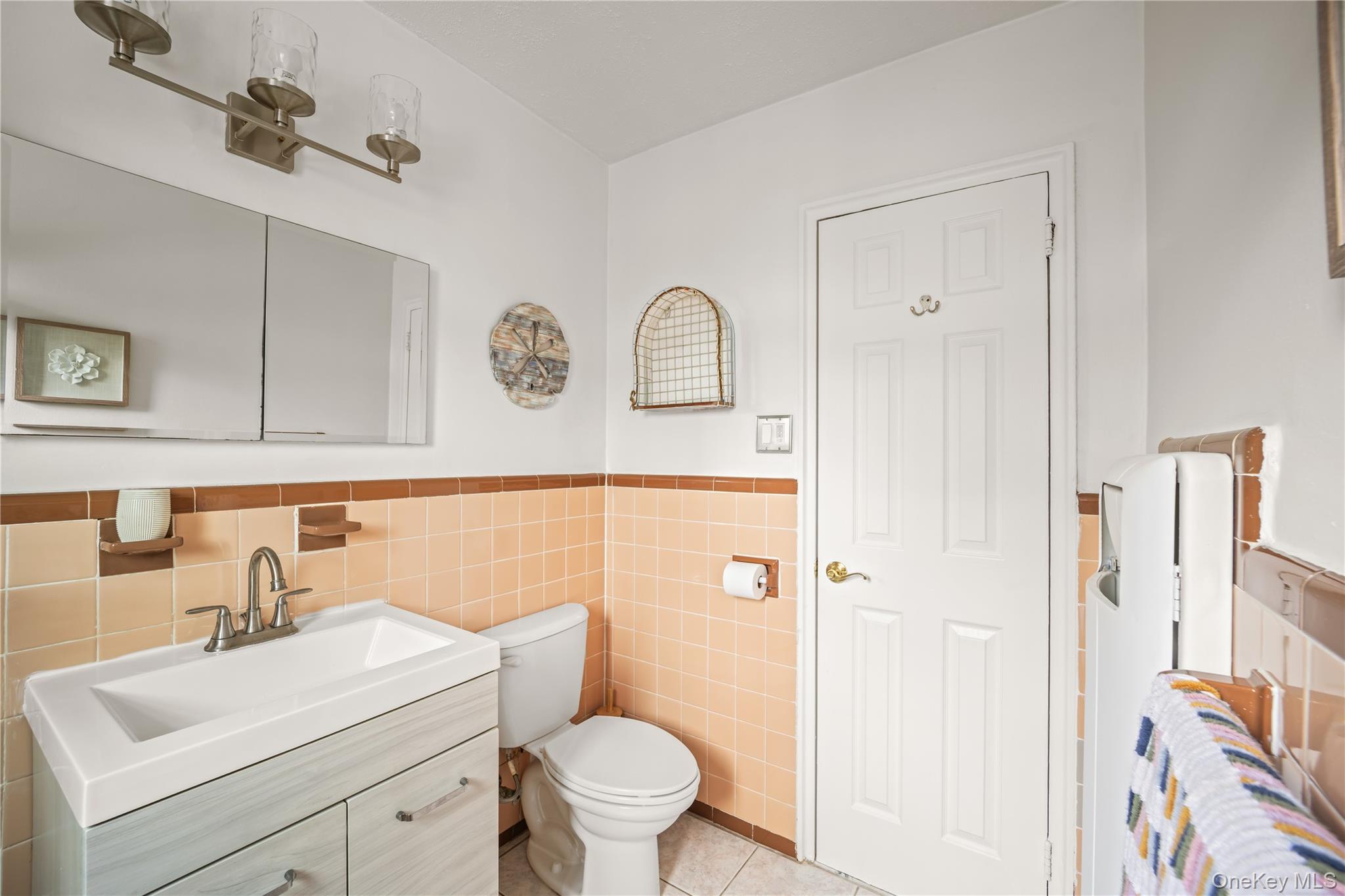98 Hawkins Street Bronx, NY 10464 - Photo 15 of 26 a bathroom with a toilet sink and mirror