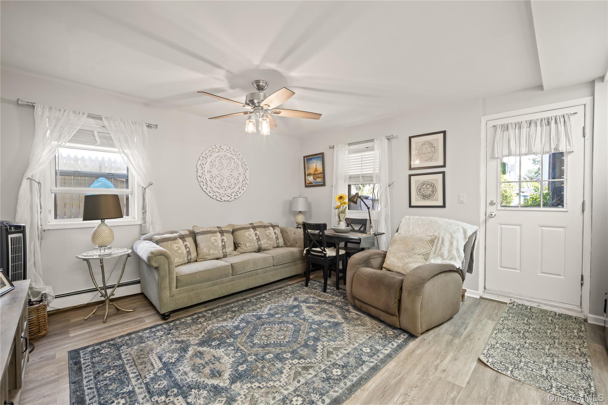 98 Hawkins Street Bronx, NY 10464 - Photo 16 of 26 a living room with furniture and a large window