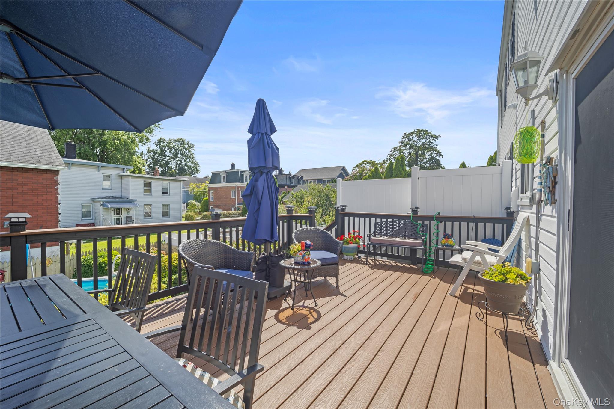 98 Hawkins Street Bronx, NY 10464 - Photo 21 of 26 a view of a balcony with wooden floor and outdoor seating
