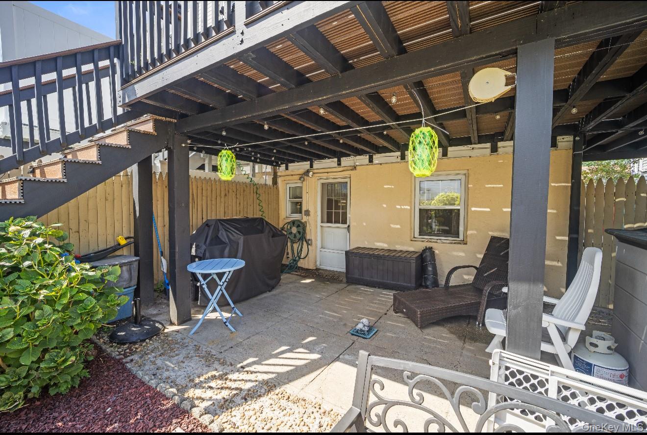 98 Hawkins Street Bronx, NY 10464 - Photo 24 of 26 a building outdoor space with patio furniture and potted plants