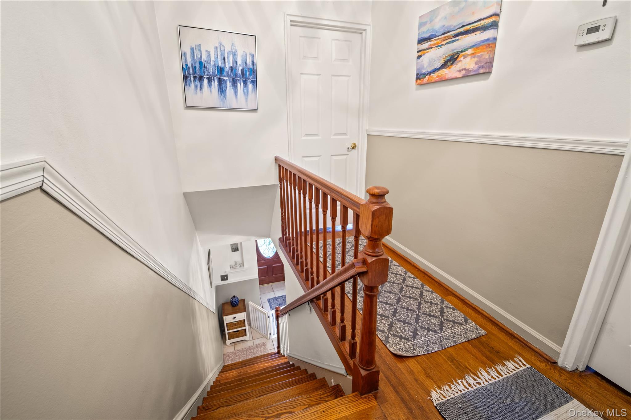98 Hawkins Street Bronx, NY 10464 - Photo 7 of 26 a view of stairs with wooden floor