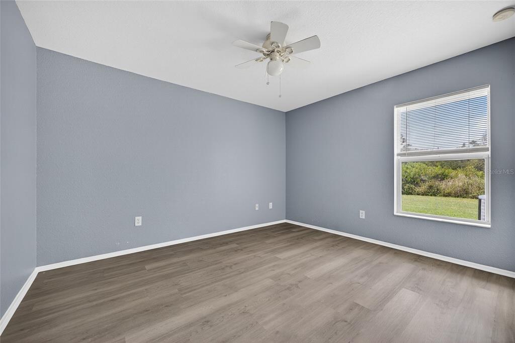 1071 Nomad Road Punta Gorda, FL 33983 - Photo 13 of 22 a view of an empty room with a window