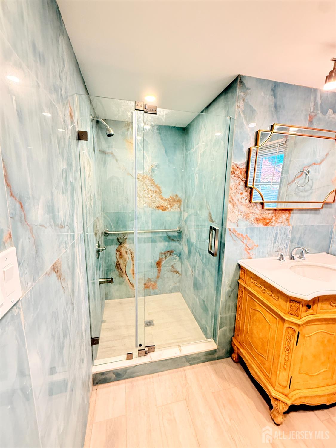 385 Pierson Avenue, Unit 1 Edison, NJ 08837 - Photo 12 of 17 a bathroom with a bathtub and a shower