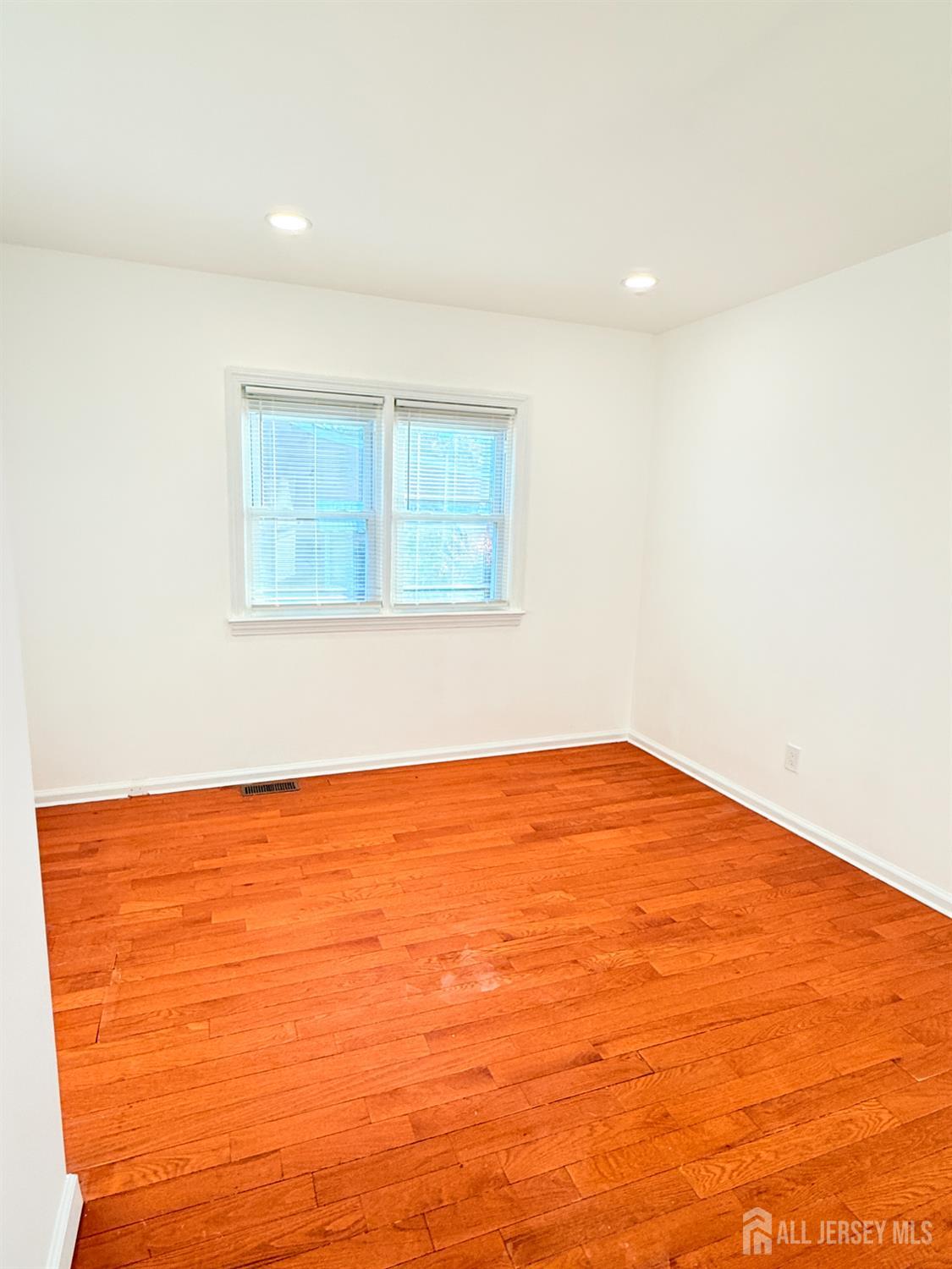 385 Pierson Avenue, Unit 1 Edison, NJ 08837 - Photo 10 of 17 an empty room with a window