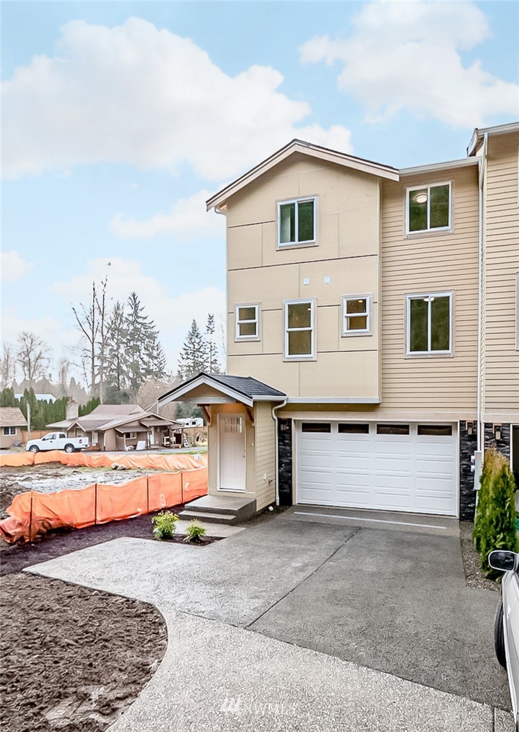 2720 Callow Road, Unit A Lake Stevens, WA 98258 - Photo 1 of 32 a front view of a house with a yard and a garage