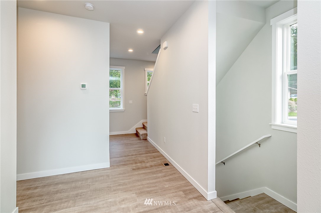 2720 Callow Road, Unit A Lake Stevens, WA 98258 - Photo 14 of 32 a view of a hallway with wooden floor and closet