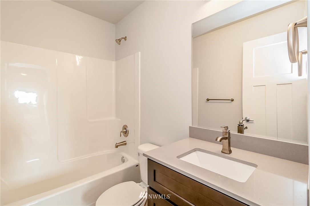 2720 Callow Road, Unit A Lake Stevens, WA 98258 - Photo 26 of 32 a bathroom with a granite countertop sink toilet and shower