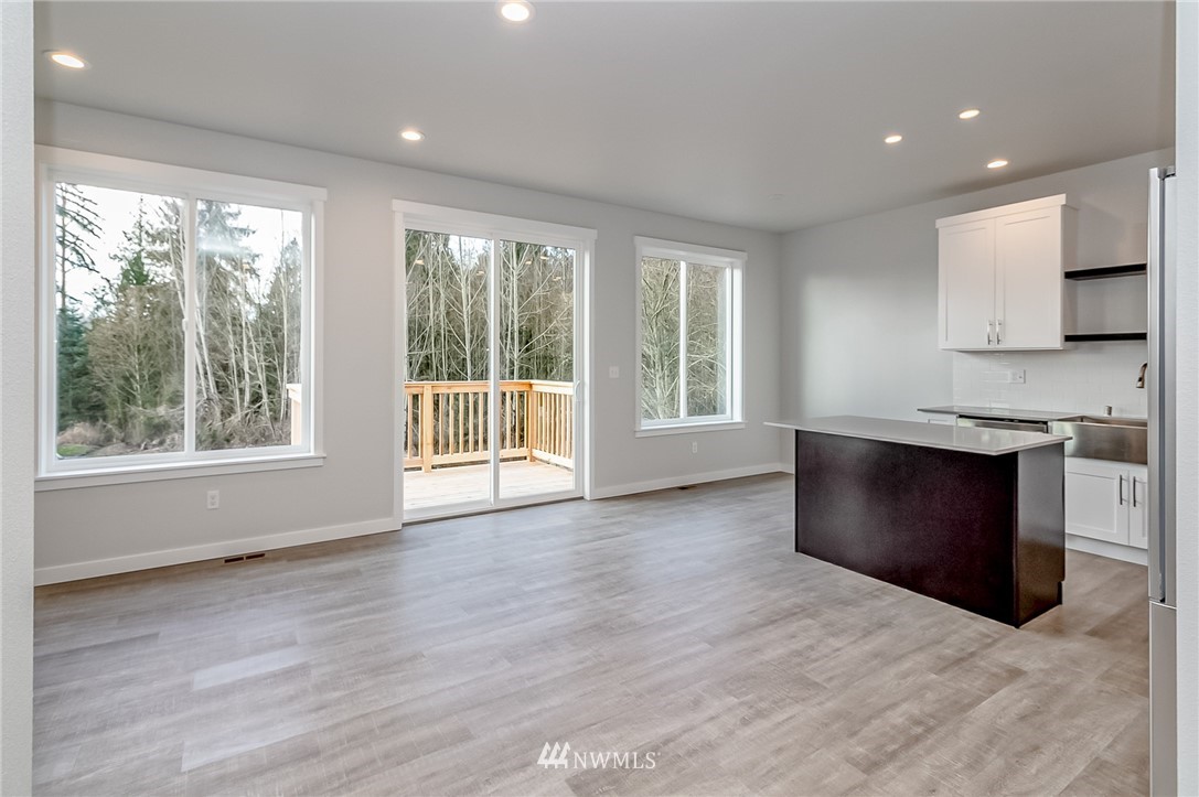 2720 Callow Road, Unit A Lake Stevens, WA 98258 - Photo 4 of 32 a view of kitchen with wooden floor and electronic appliances