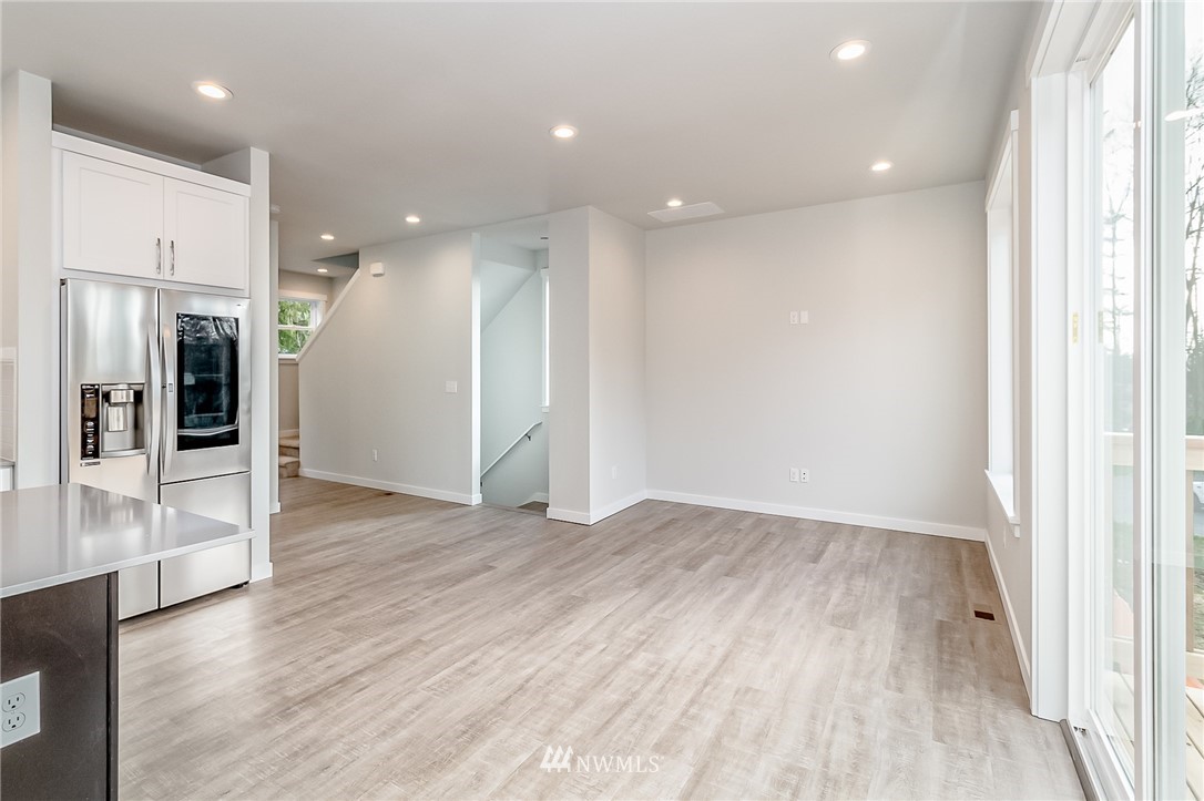 2720 Callow Road, Unit A Lake Stevens, WA 98258 - Photo 5 of 32 an empty room with wooden floor and windows