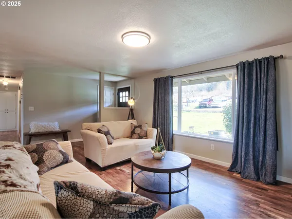 a living room with furniture and a window