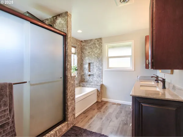 a bath tub sitting in a bathroom next to a window