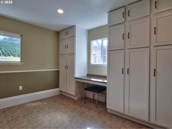 a kitchen with a refrigerator sink stove and cabinets