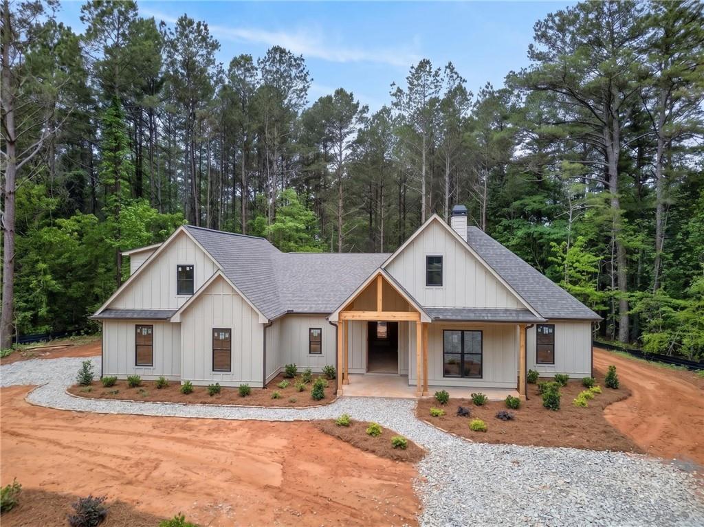 1698 Tibbitts Road Dallas, GA 30132 - Photo 2 of 16 a front view of a house with a yard