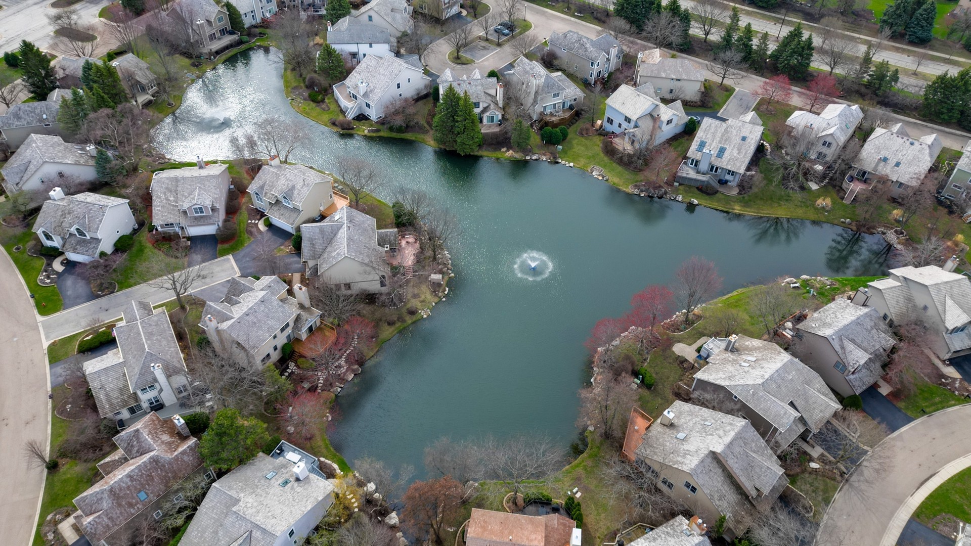 2286 Brookside Lane Aurora, IL 60502 - Photo 34 of 37 an aerial view of a house with a lake view