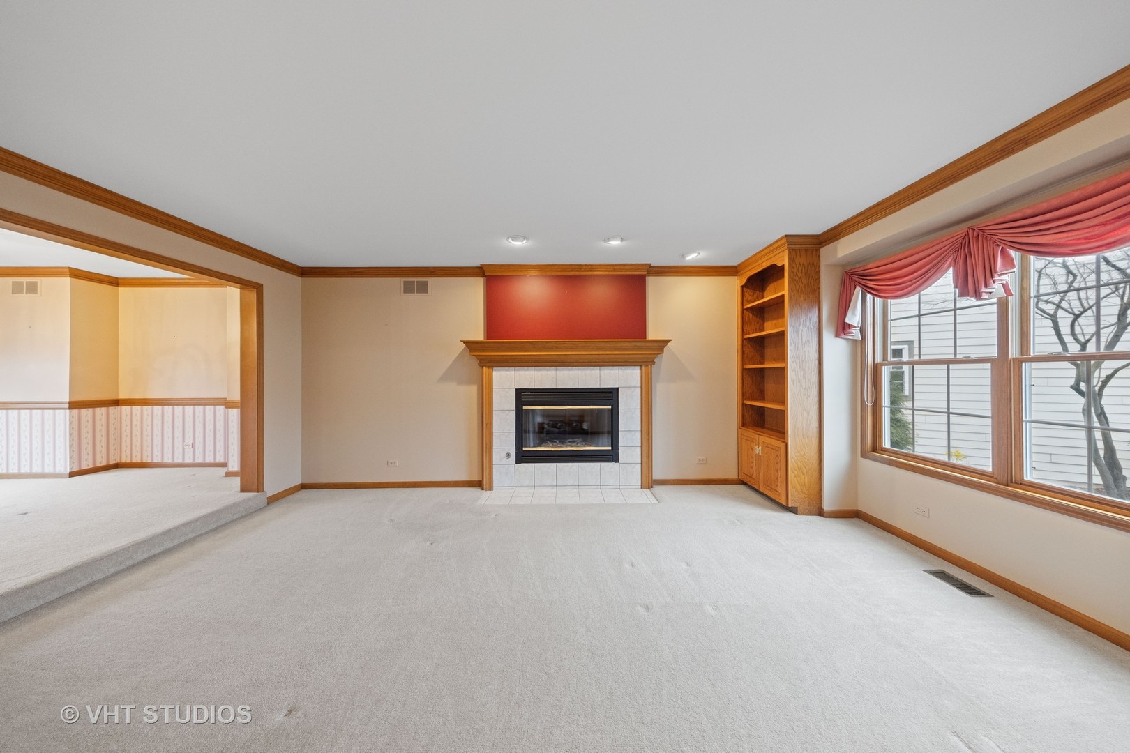 2286 Brookside Lane Aurora, IL 60502 - Photo 4 of 37 a view of an empty room with a fireplace and a window