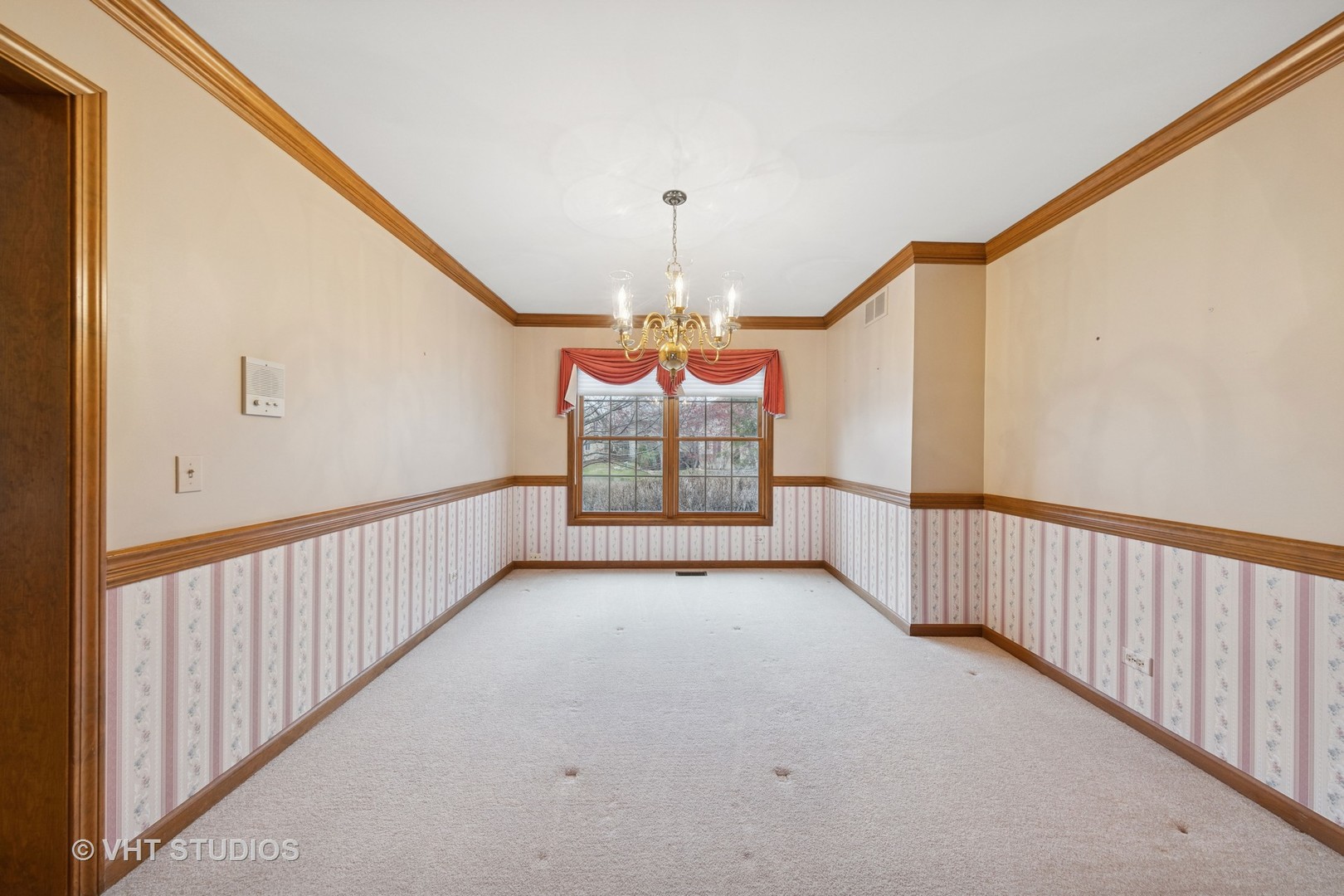2286 Brookside Lane Aurora, IL 60502 - Photo 5 of 37 a view of a hallway with a chandelier