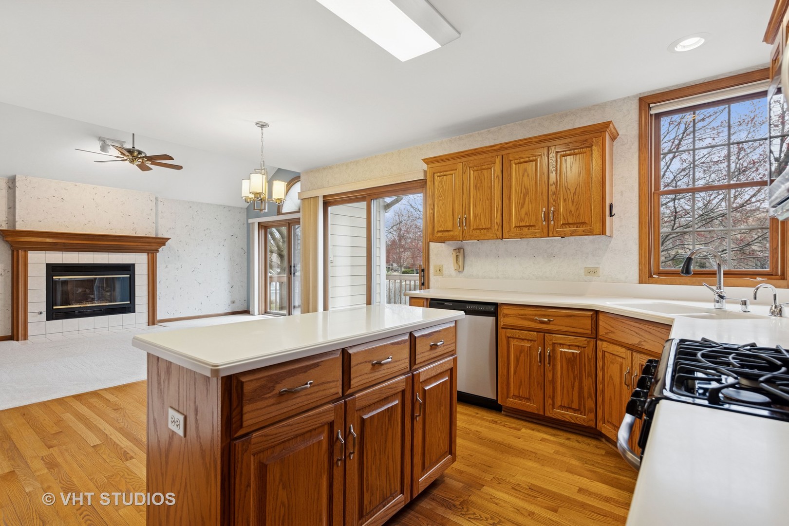 2286 Brookside Lane Aurora, IL 60502 - Photo 8 of 37 a kitchen with stainless steel appliances granite countertop a stove a sink dishwasher and a refrigerator with wooden floor