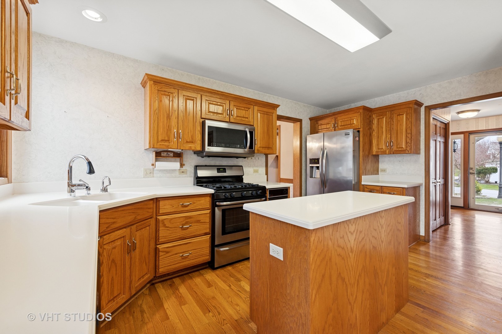 2286 Brookside Lane Aurora, IL 60502 - Photo 9 of 37 a kitchen with stainless steel appliances kitchen island granite countertop a sink stove and refrigerator
