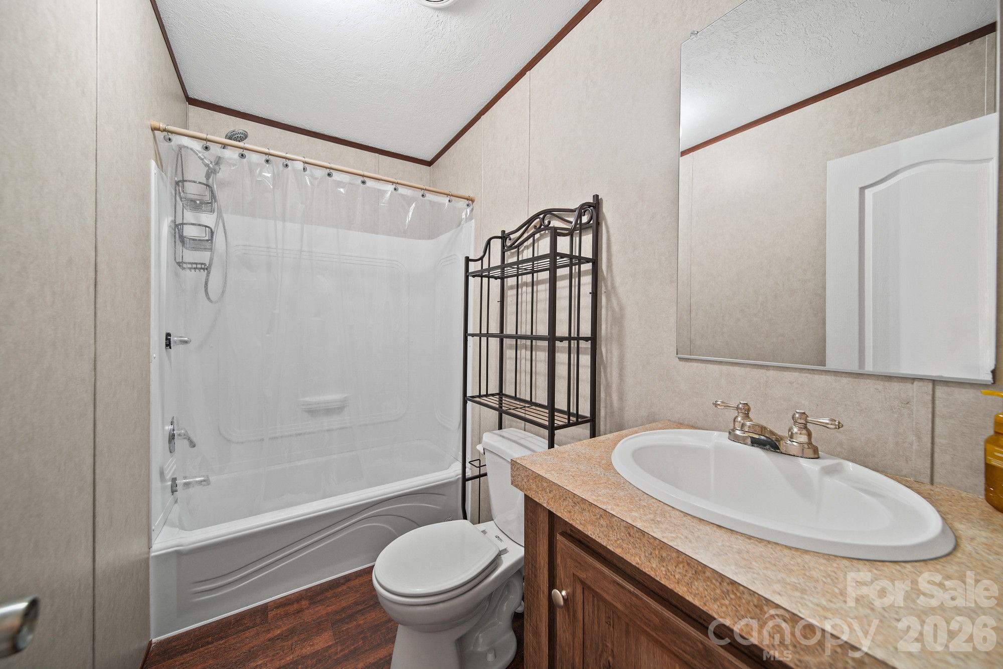 4507 White Store Road Wingate, NC 28174 - Photo 23 of 29 a bathroom with a sink toilet and shower