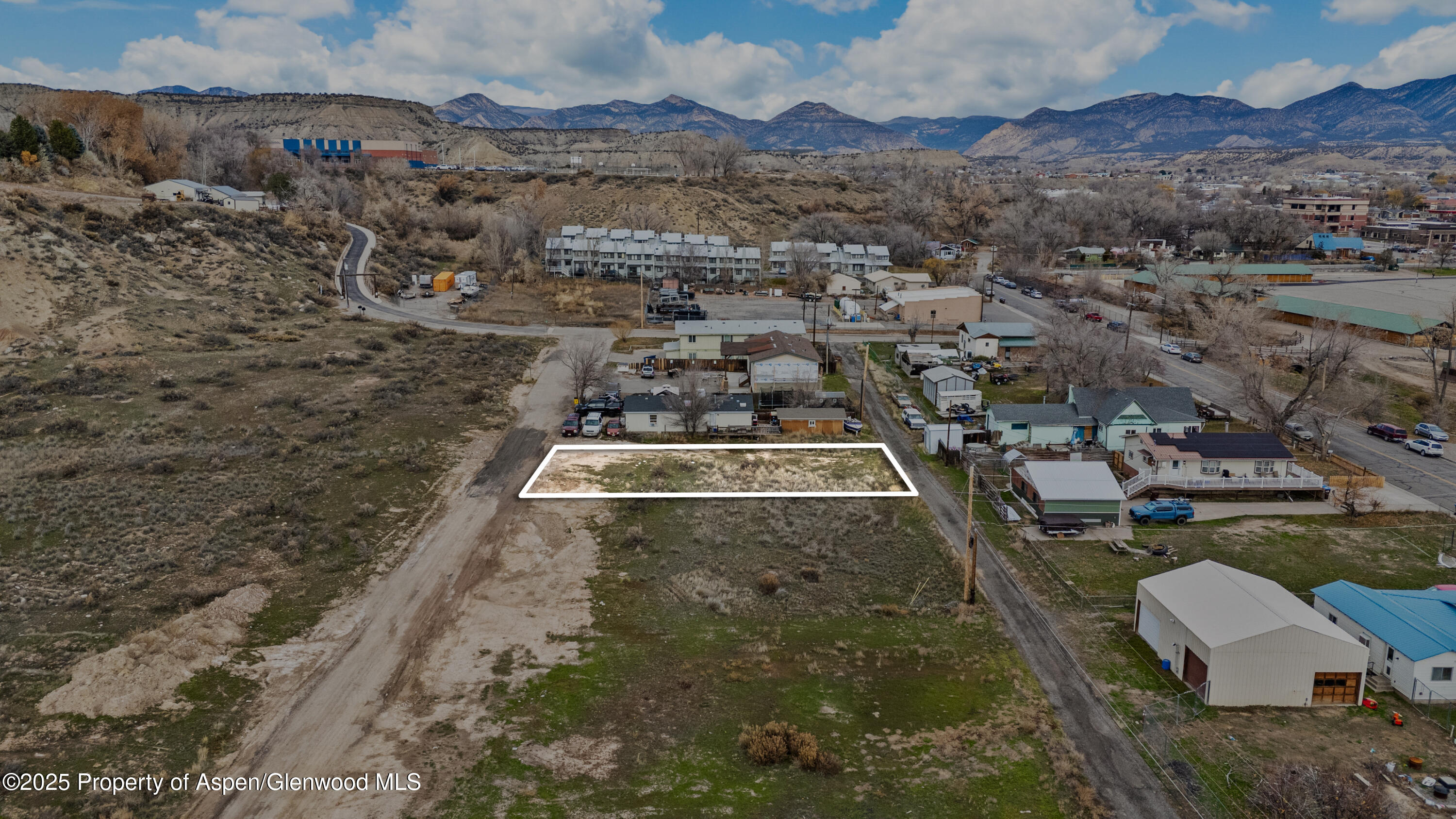 988 Stillwell Avenue Rifle, CO 81650 - Photo 9 of 10 an aerial view of residential houses with outdoor space
