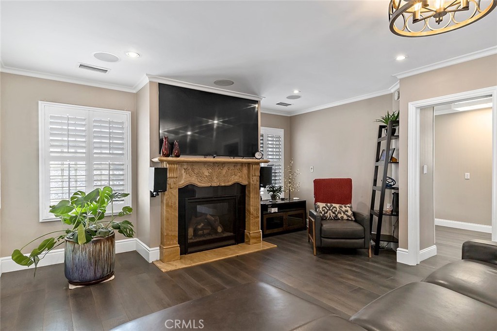 5733 2nd Street Long Beach, CA 90803 - Photo 15 of 32 a living room with furniture a fireplace and a flat screen tv