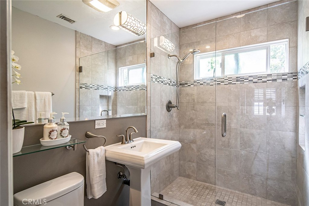 5733 2nd Street Long Beach, CA 90803 - Photo 17 of 32 a bathroom with a sink toilet and shower