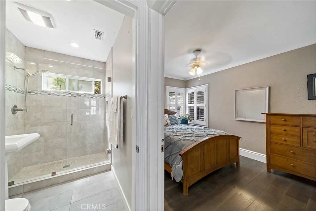 5733 2nd Street Long Beach, CA 90803 - Photo 18 of 32 a bedroom with a bed and a dresser