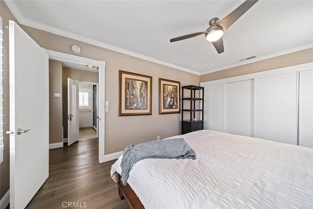 5733 2nd Street Long Beach, CA 90803 - Photo 24 of 32 a bedroom with a large bed and a chandelier