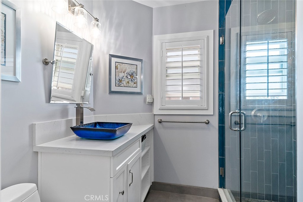 5733 2nd Street Long Beach, CA 90803 - Photo 25 of 32 a bathroom with a sink and a window