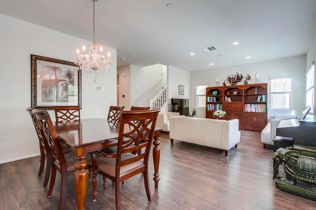 235 Spotted Saddle Way Fallbrook, CA 92028 - Photo 17 of 71 a view of a dining room with furniture and wooden floor