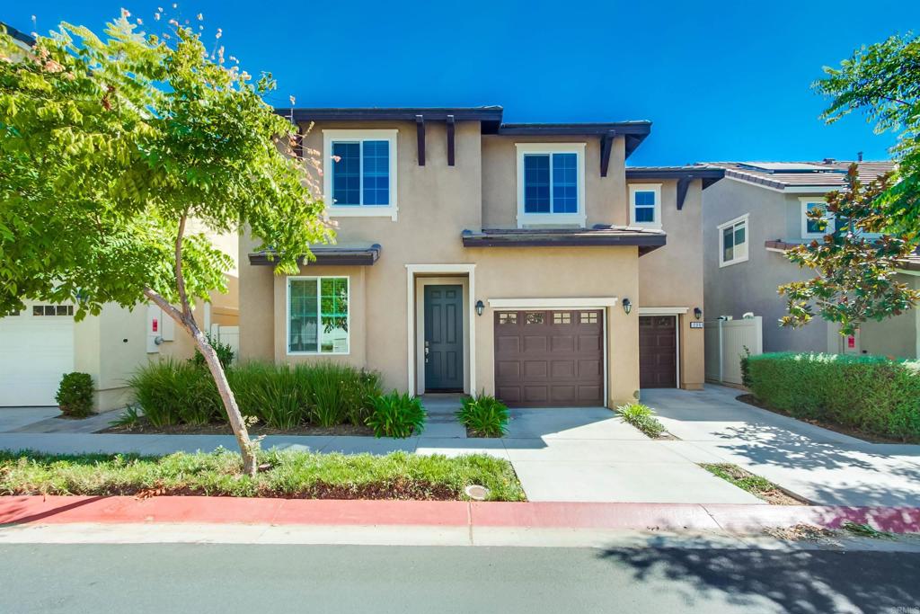 235 Spotted Saddle Way Fallbrook, CA 92028 - Photo 2 of 71 a front view of a house with garden