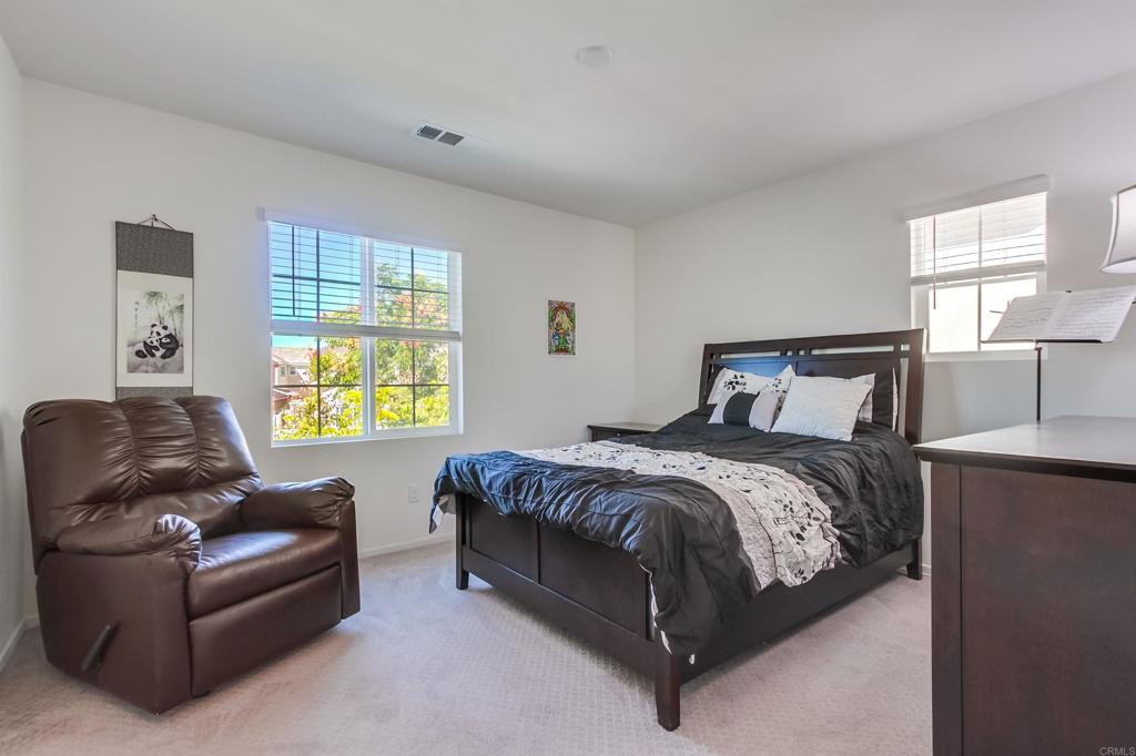 235 Spotted Saddle Way Fallbrook, CA 92028 - Photo 34 of 71 a bedroom with a bed couch and window