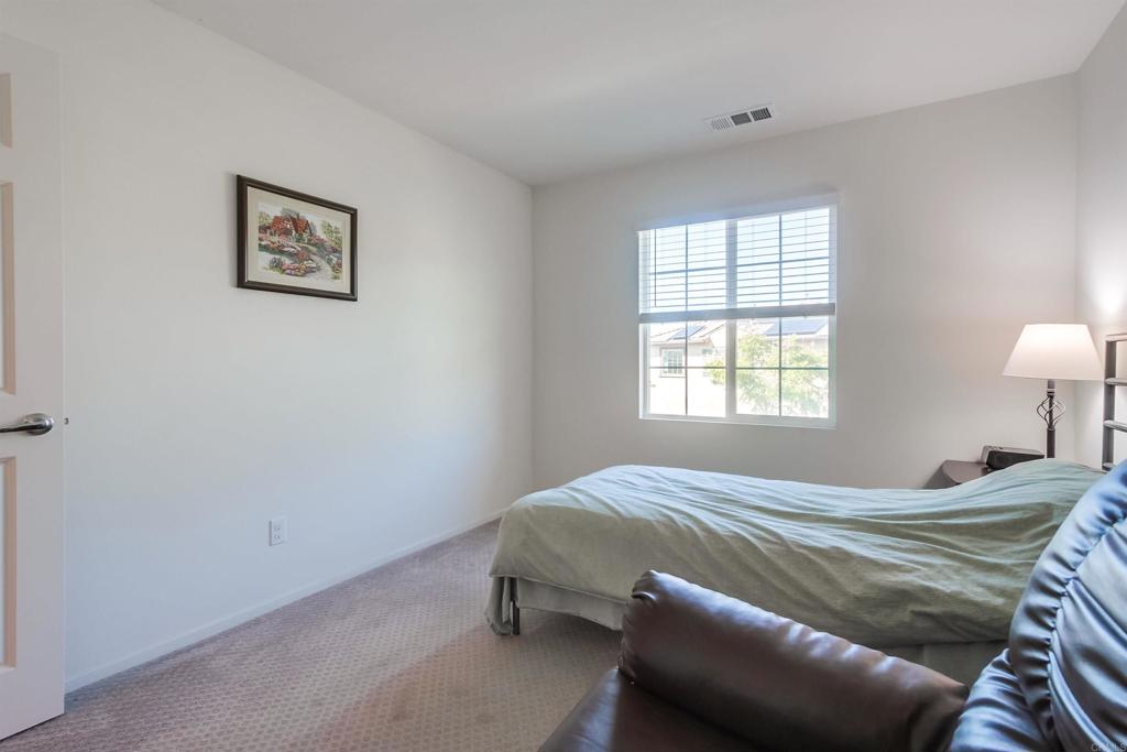 235 Spotted Saddle Way Fallbrook, CA 92028 - Photo 37 of 71 a bedroom with a bed and a window
