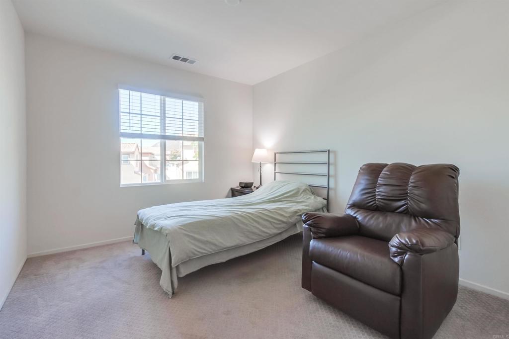 235 Spotted Saddle Way Fallbrook, CA 92028 - Photo 38 of 71 a bedroom with bed couch and window