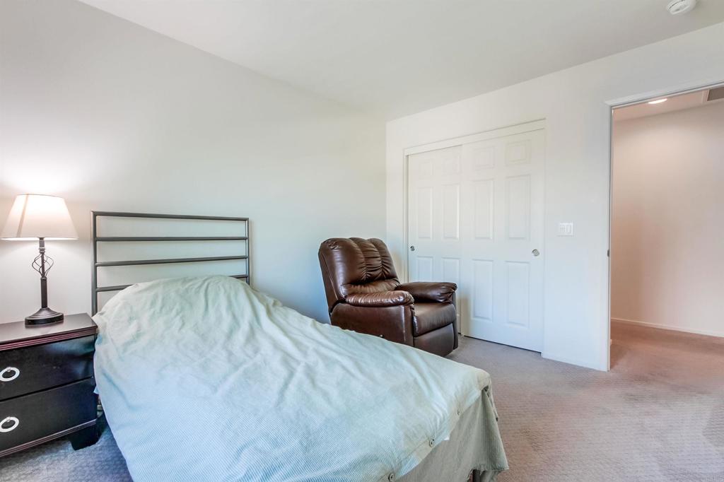 235 Spotted Saddle Way Fallbrook, CA 92028 - Photo 39 of 71 a room with a bed and a chair