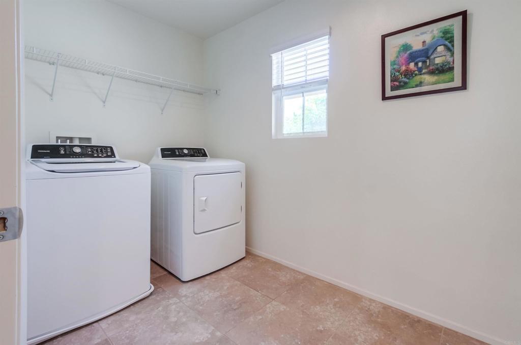 235 Spotted Saddle Way Fallbrook, CA 92028 - Photo 40 of 71 a view of storage and utility room with washer and dryer