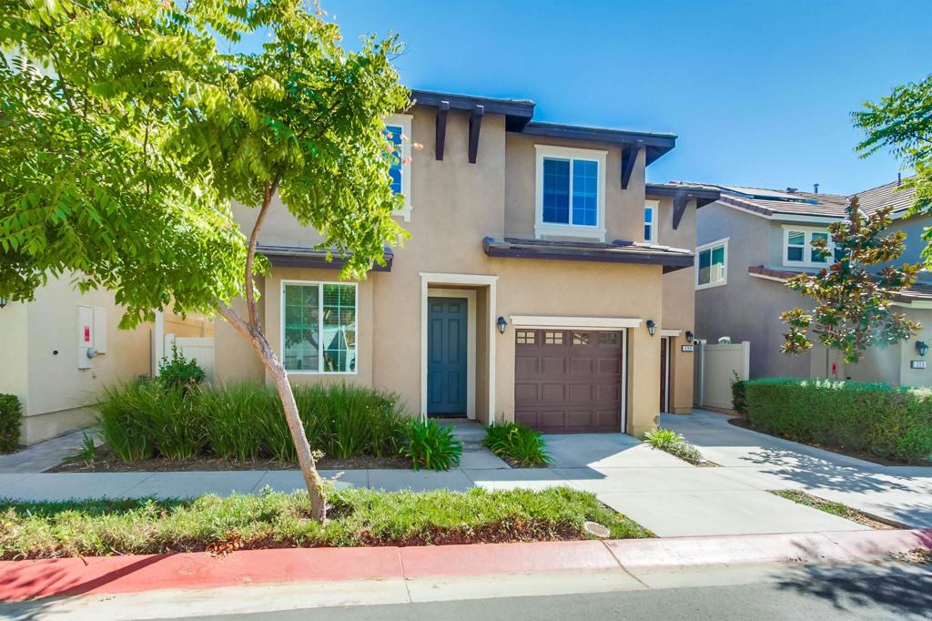 235 Spotted Saddle Way Fallbrook, CA 92028 - Photo 4 of 71 a front view of a house with a garden and plants