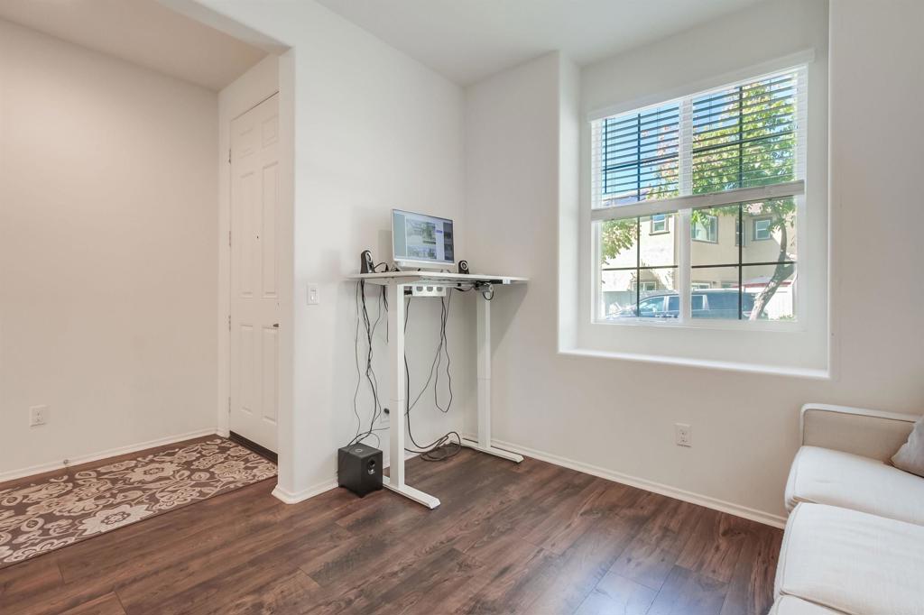 235 Spotted Saddle Way Fallbrook, CA 92028 - Photo 7 of 71 a view of empty room with wooden floor and fan