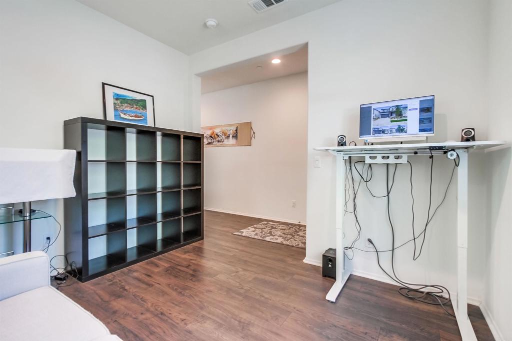 235 Spotted Saddle Way Fallbrook, CA 92028 - Photo 8 of 71 a view of a bedroom with wooden floor and closet