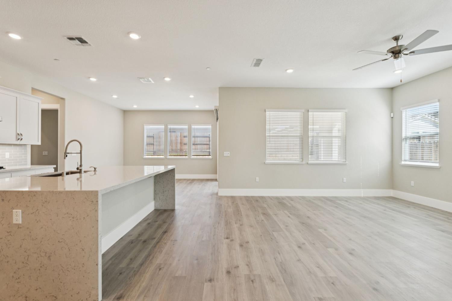 3031 Pocosol Way Rancho Cordova, CA 95742 - Photo 13 of 47 a large kitchen with stainless steel appliances a large window a sink and a refrigerator