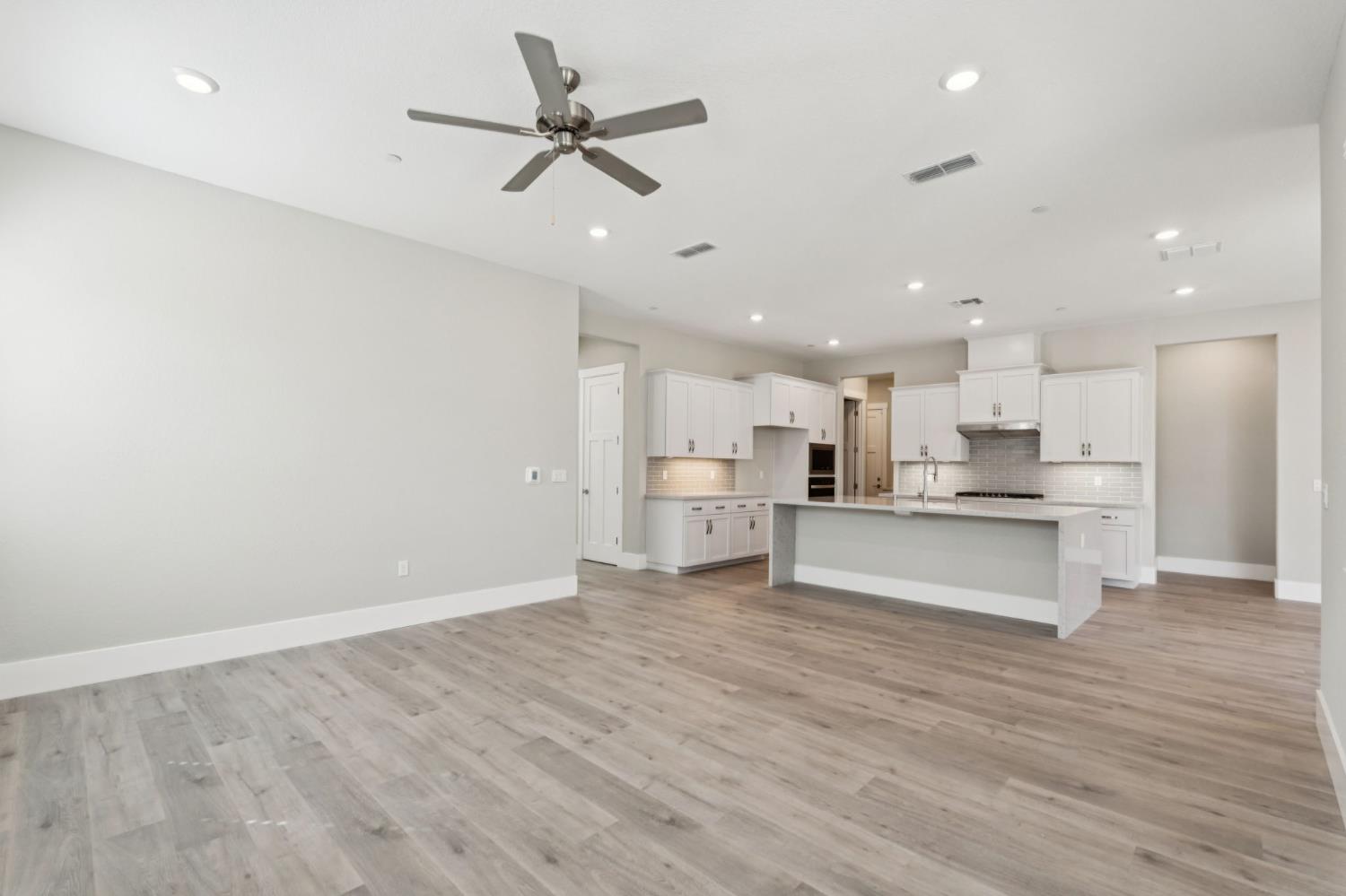 3031 Pocosol Way Rancho Cordova, CA 95742 - Photo 15 of 47 a view of kitchen with kitchen island stainless steel appliances refrigerator stove microwave and cabinets