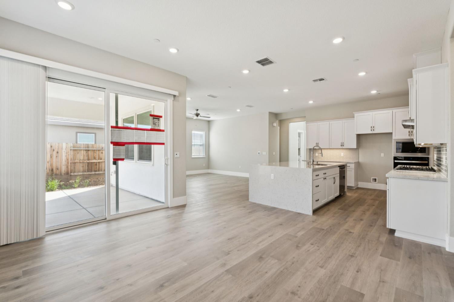 3031 Pocosol Way Rancho Cordova, CA 95742 - Photo 16 of 47 a view of kitchen with stainless steel appliances kitchen island wooden floors and view living room