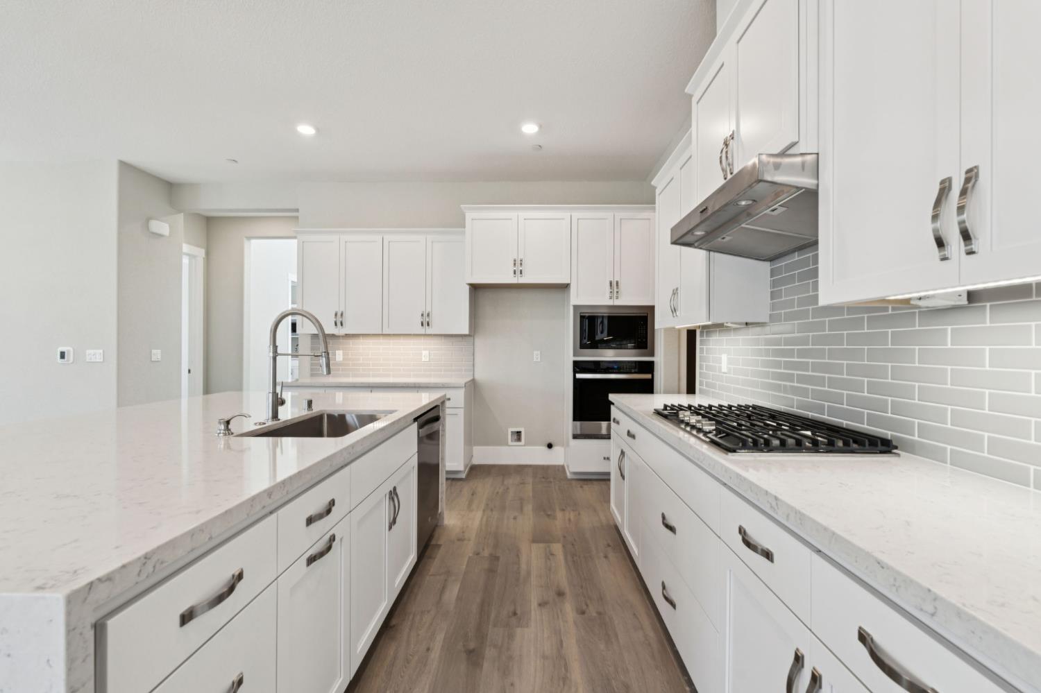 3031 Pocosol Way Rancho Cordova, CA 95742 - Photo 20 of 47 a kitchen with white cabinets a sink and appliances