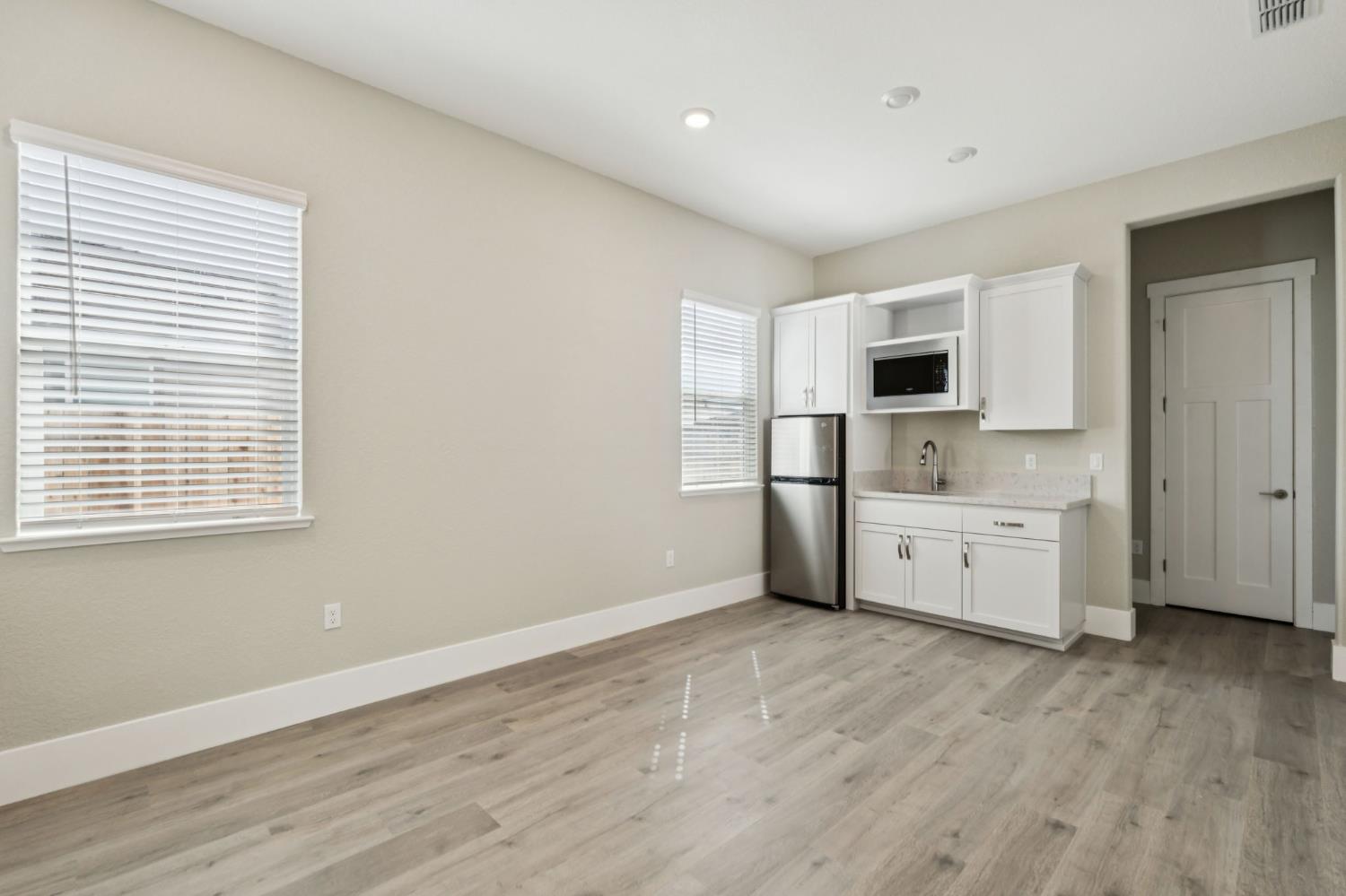 3031 Pocosol Way Rancho Cordova, CA 95742 - Photo 21 of 47 a kitchen with stainless steel appliances a refrigerator and a stove top oven