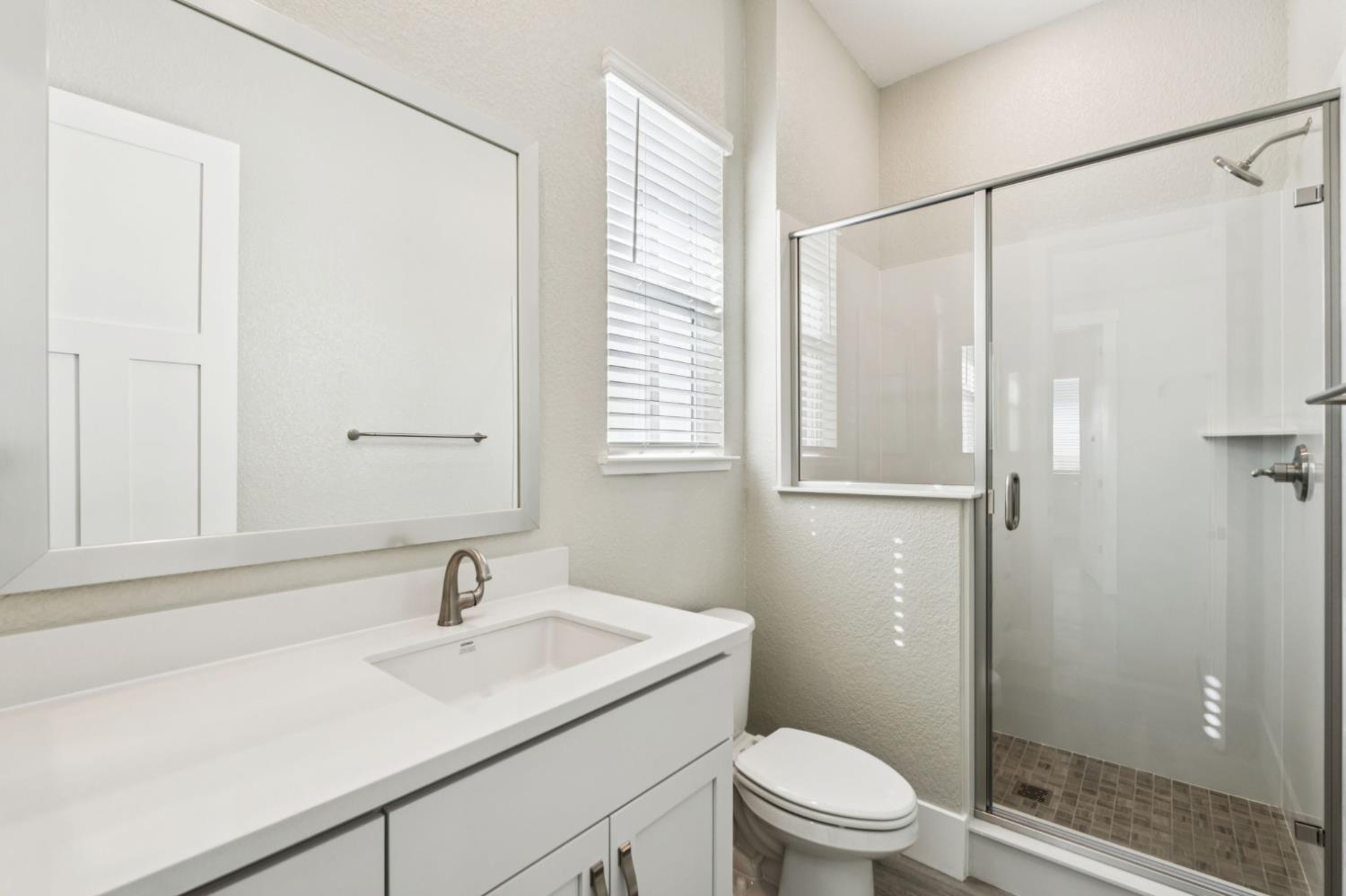 3031 Pocosol Way Rancho Cordova, CA 95742 - Photo 28 of 47 a bathroom with a sink toilet a mirror and shower