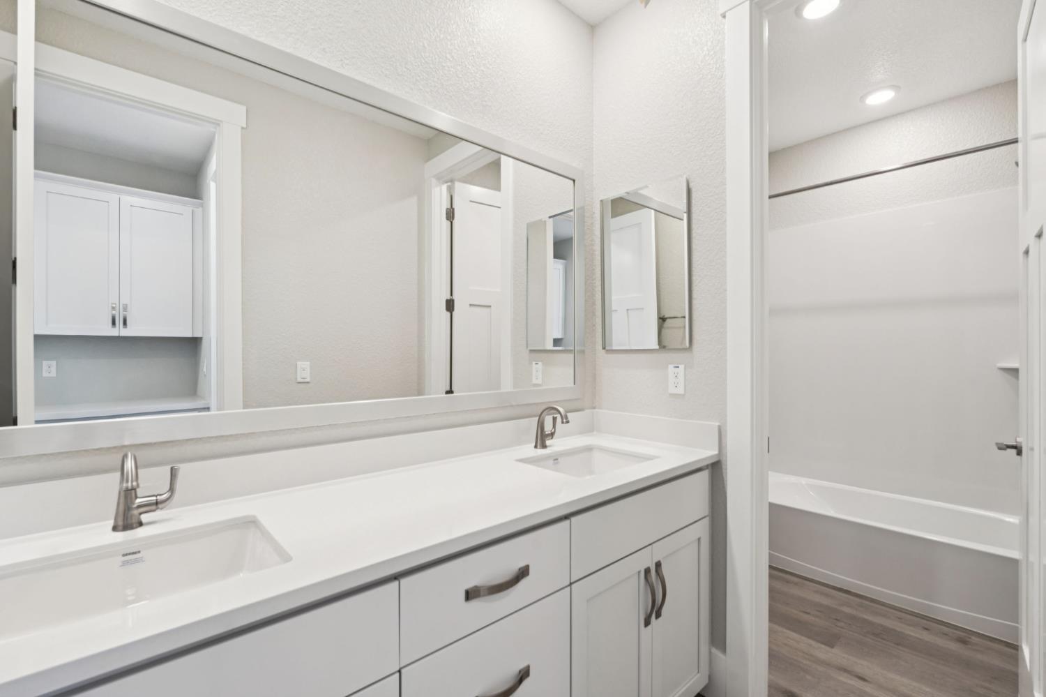 3031 Pocosol Way Rancho Cordova, CA 95742 - Photo 43 of 47 a bathroom with a sink and a mirror