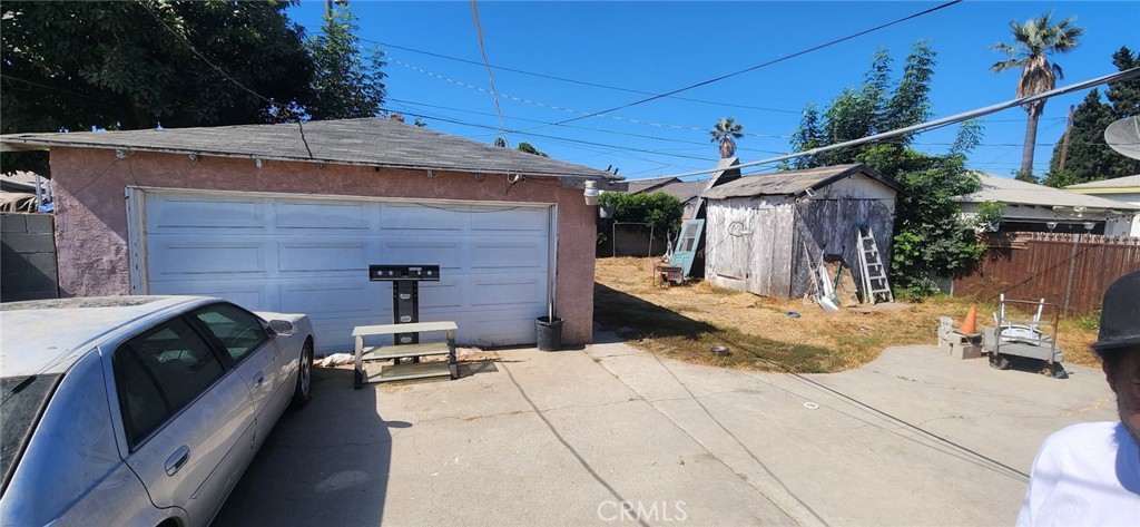 1313 South California Avenue Compton, CA 90221 - Photo 2 of 12 a view of a patio with table and chairs potted plants