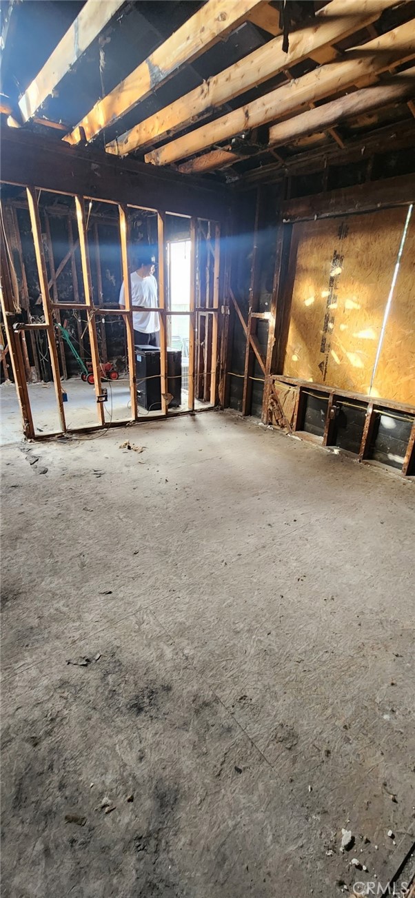 1313 South California Avenue Compton, CA 90221 - Photo 6 of 12 a view of an empty room with wooden floor
